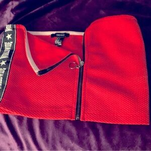 Red zip up top